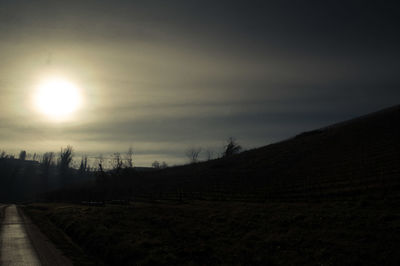 Silhouette landscape against sky during sunset