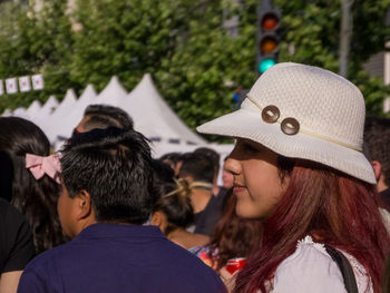 Rear view of two people standing outdoors