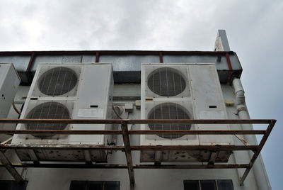 Low angle view of abandoned building against sky