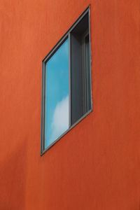 Full frame shot of orange wall of building