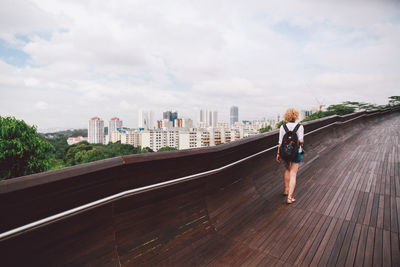 Woman standing on city street