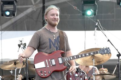 Portrait of man playing guitar