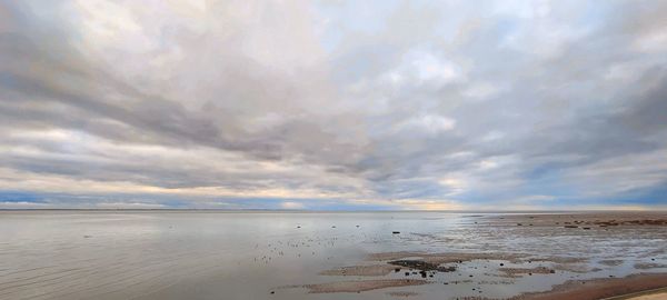 Scenic view of beach against sky