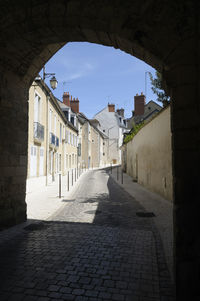 Footpath amidst buildings in town