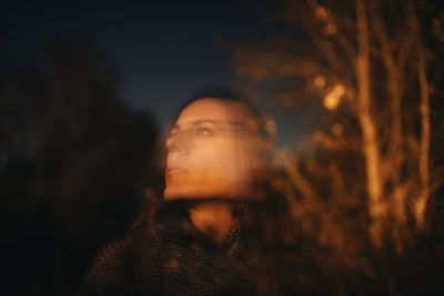 Young woman looking away outdoors