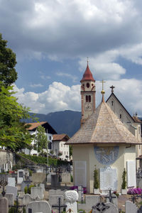 View of buildings in city against sky