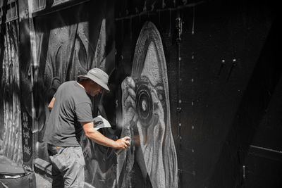 Man working on wall