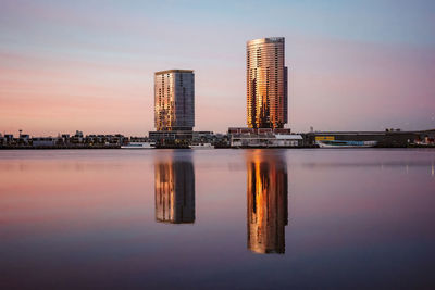 Reflection of illuminated buildings in city