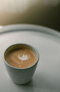 Close-up of cappuccino on table