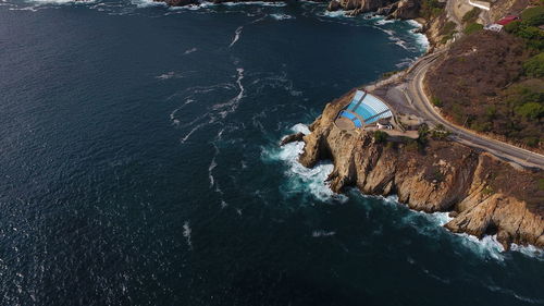 High angle view of rock formation in sea