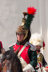 Midsection of man with arms raised