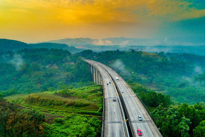 High angle view of cars on road against sky