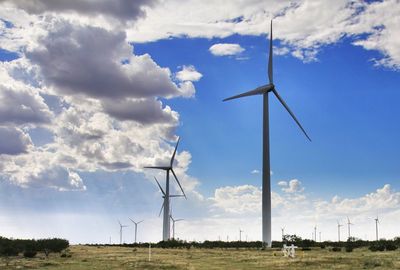 Wind turbines in field