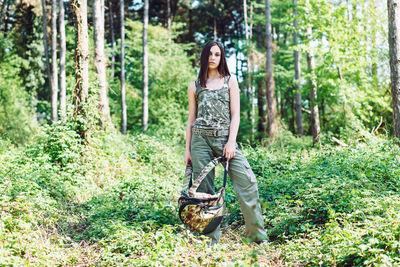 Full length portrait of a man in forest