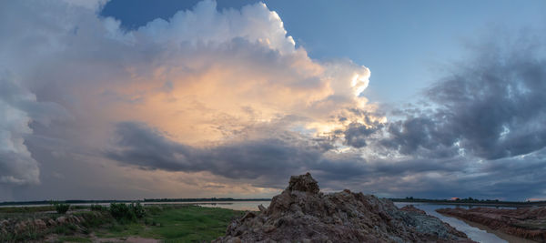 Panoramic view of rocks against sky during sunset