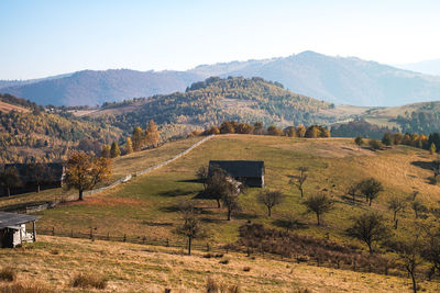 Scenic view of landscape and mountains against sky