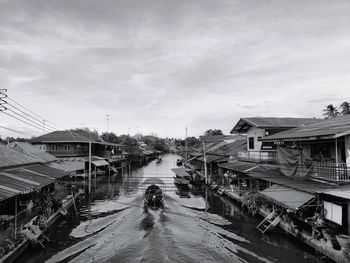 View of wet city street during rainy season