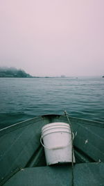 Boat in calm sea in front of clear sky