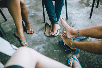 Low section of people sitting outdoors