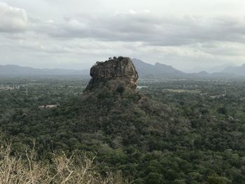 Rock formations on landscape against sky