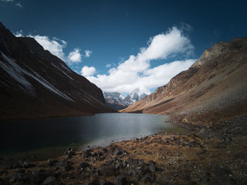 Scenic view of lake and mountains against sky