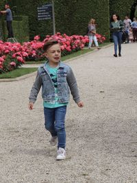 Full length of mother and daughter walking on plant