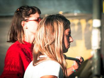 Close-up of female friends during sunny day