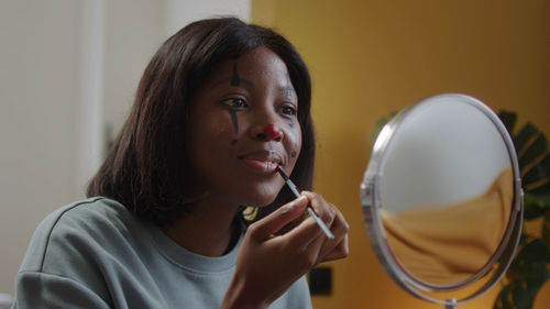 Close-up of young woman looking away