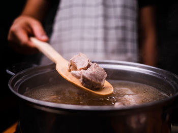 Close-up of hand holding ice cream