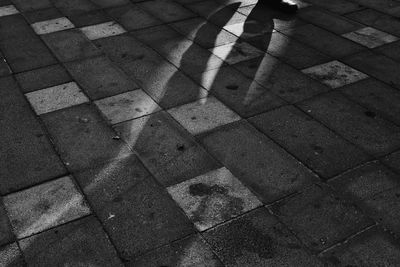 High angle view of shadow on footpath