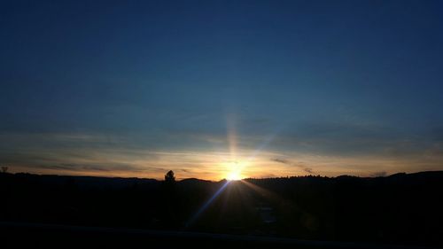 Sun shining through clouds