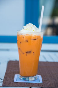 Close-up of iced coffee served on table