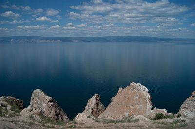 Scenic view of lake and mountains against sky