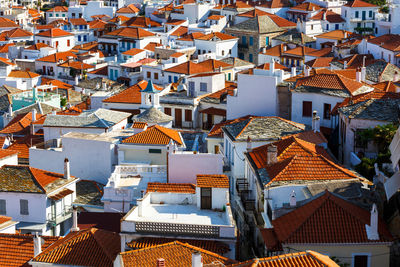 White houses with red roofs in skopelos town, greece.