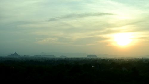 Silhouette landscape against sky during sunset