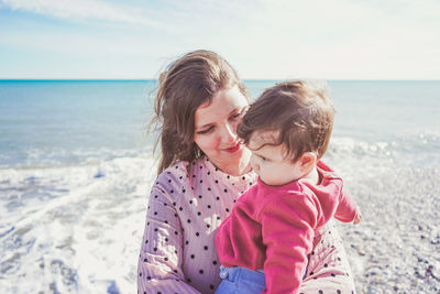 Mother and daughter at beach