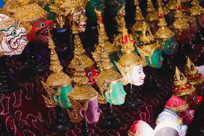Close-up of decorations hanging for sale in market