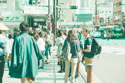 People walking on street in city