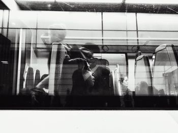 Reflection of man on glass window