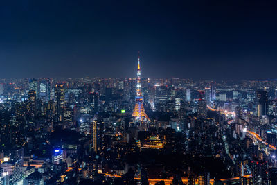 High angle view of illuminated cityscape at night