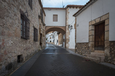 Historical streets of the medieval village of uclés with stone buildings, cuenca, spain