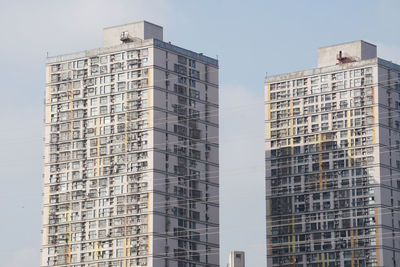 Low angle view of modern buildings against sky