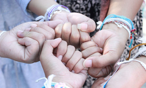 Close-up of hands holding baby
