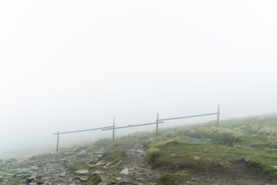 View of railing in foggy weather