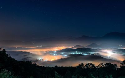Scenic view of sea of clouds on jinlong mountain at night, taichung taiwan
