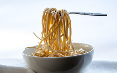 Close-up of noodles in bowl on table
