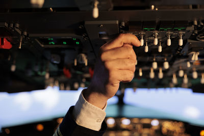 Cropped hand of man using mobile phone