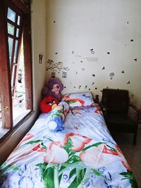 Boy lying on bed at home