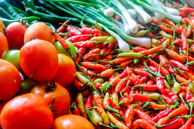 Tomatoes and vegetables for sale at market stall