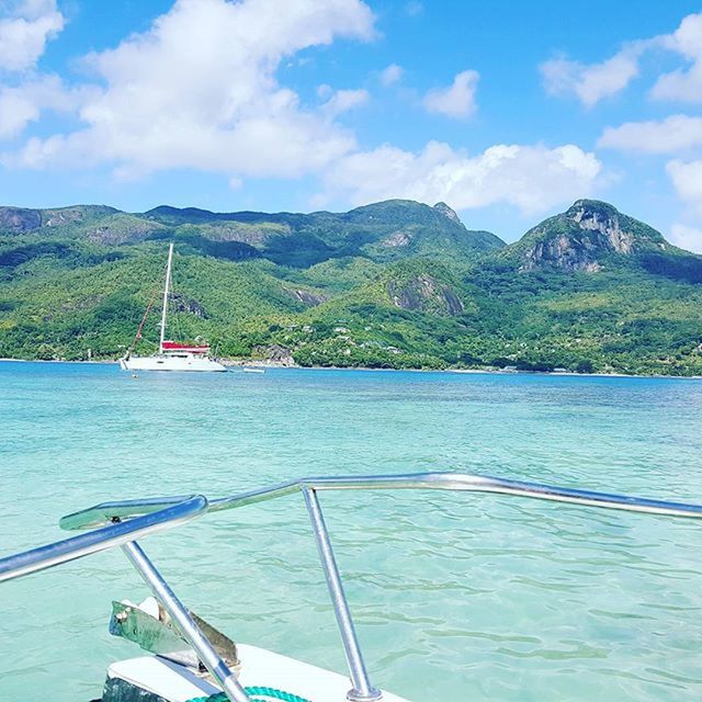 mountain, water, nautical vessel, mountain range, boat, transportation, sky, tranquility, tranquil scene, scenics, lake, mode of transport, beauty in nature, nature, moored, cloud - sky, day, idyllic, non-urban scene, rippled